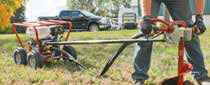 Little Beaver earth auger drill reduces turf damage